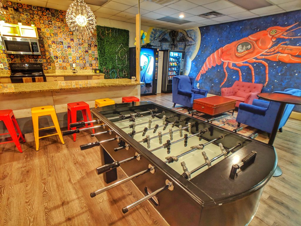 Foosball table in common room at City House Hostel