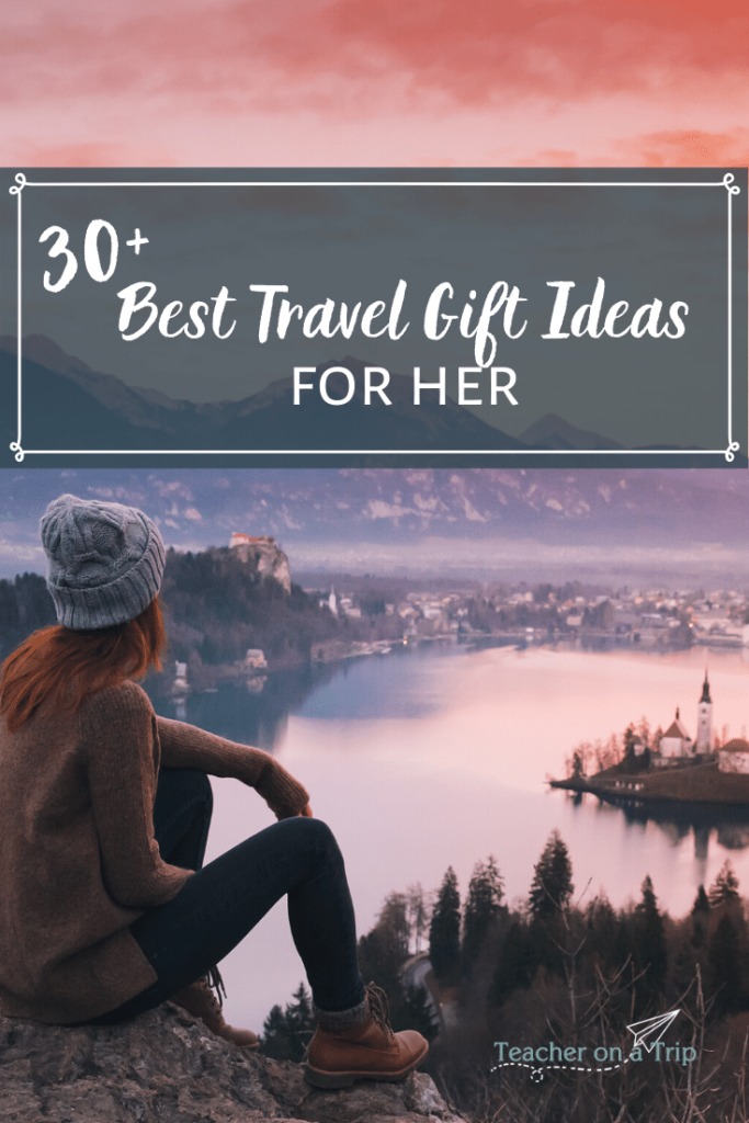Background: Woman sitting and looking over lake and city. Text: Best Travel Gift Ideas for Her 2019