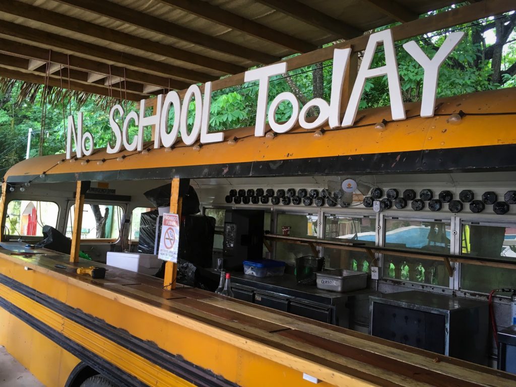 School bus converted to a bar with a "No School Today" sign.