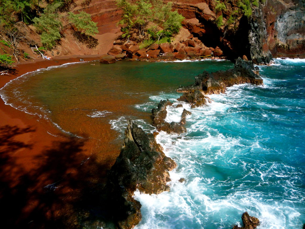 Distant view of red sand beach