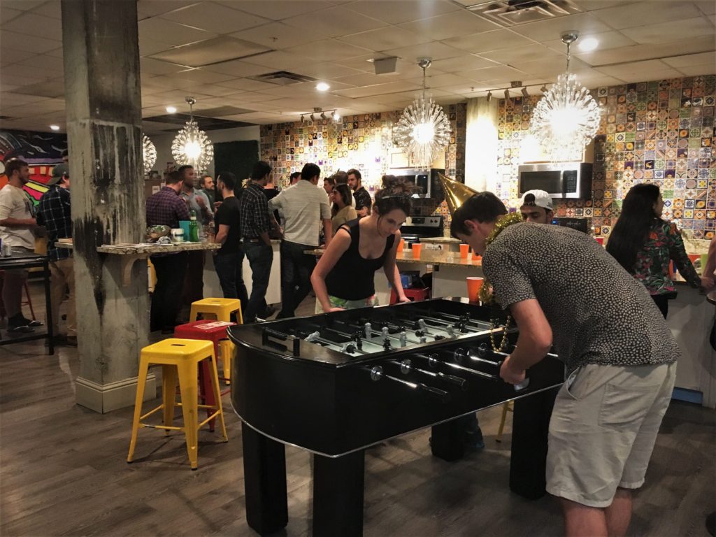 people playing foosball at City House Hostel