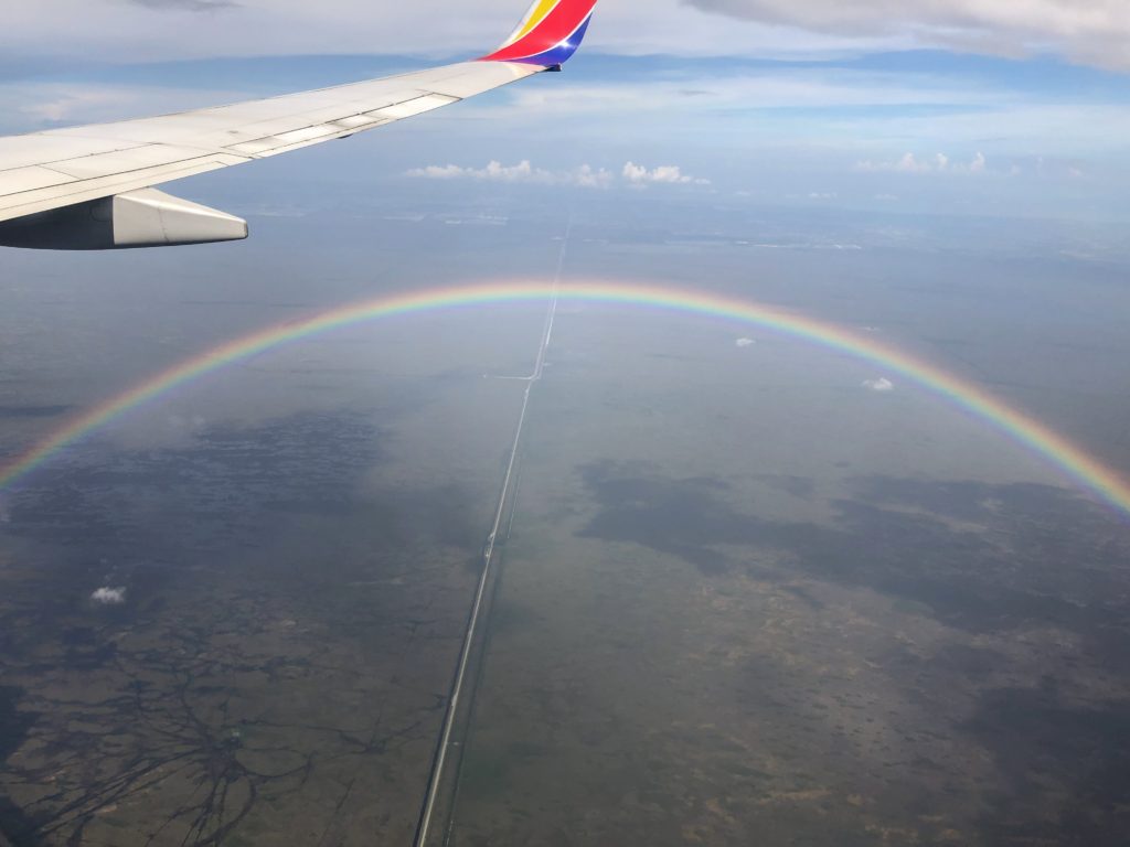 Rainbow visible out the airplane window.