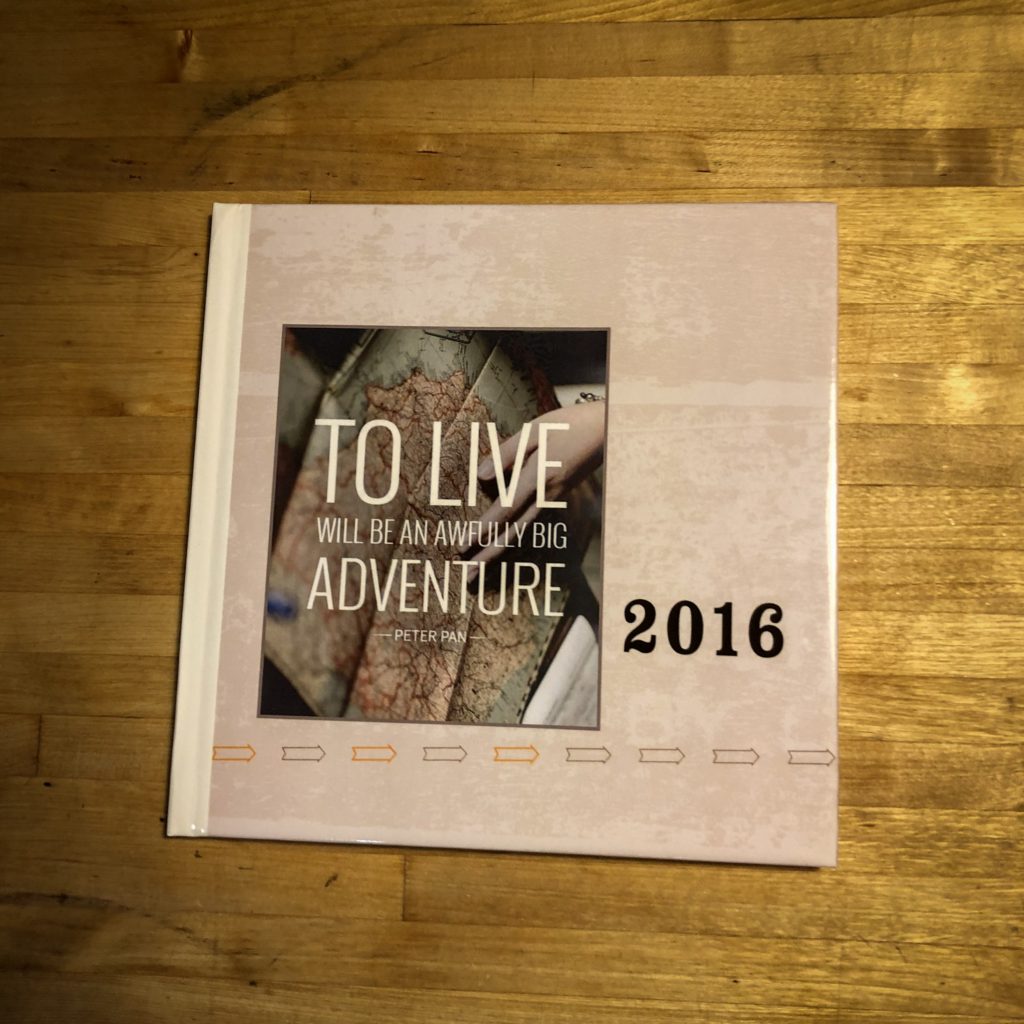 Shutterfly photo book. Image on front says: To Live will be an awfully big adventure. 2016.