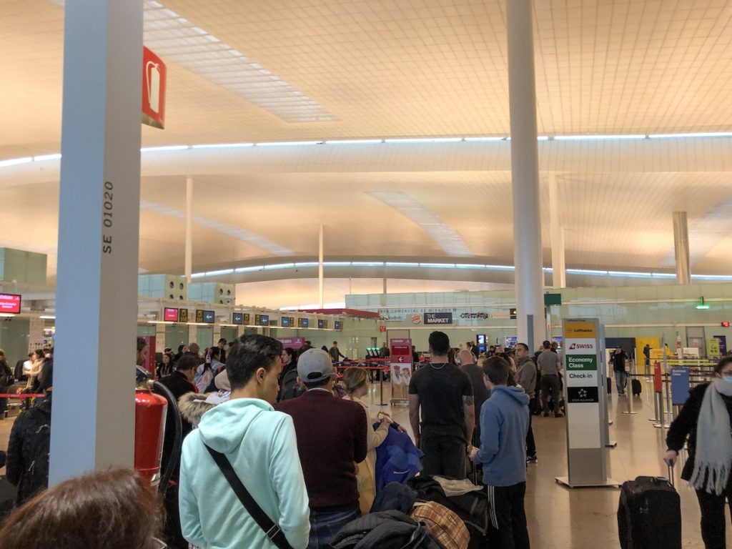 Long lines formed for airport check-in at the end of spring break.