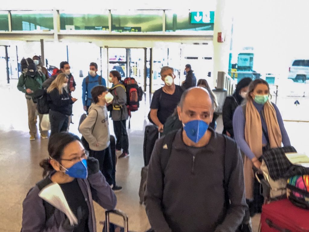 Many people wore masks to prevent coronavirus at Barcelona airport.