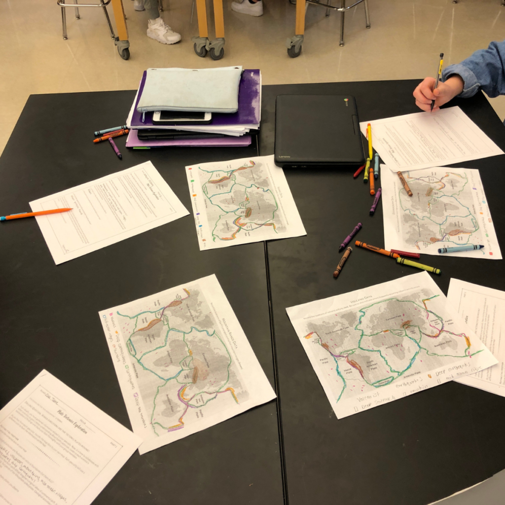 Students analyze maps during an NGSS aligned lesson