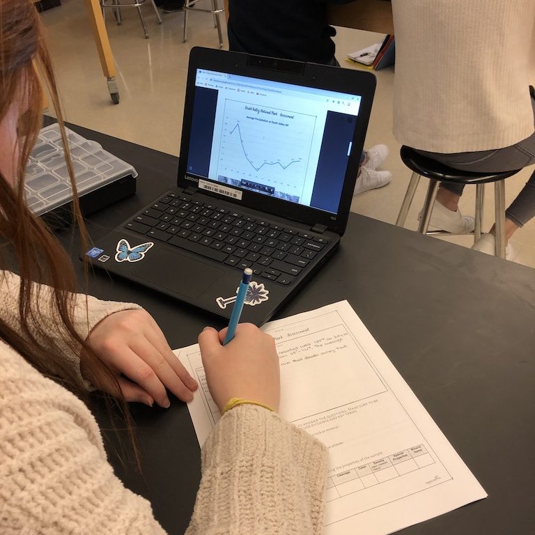 Student completes the final "E" in the 5 E lesson - Evaluate while taking a test on the Chromebook and paper.